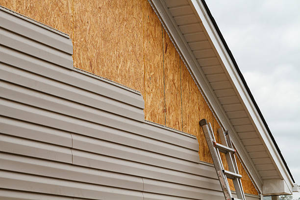 Professional Siding technician working in Wellesley Hills, MA